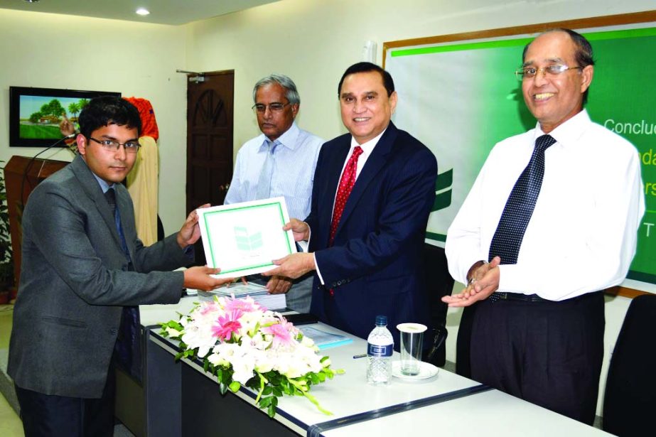 Shamsul Huda Khan, Managing Director and CEO of National Bank Limited, distributing certificates among the participants of a foundation training course at the bank's Training Institute recently.