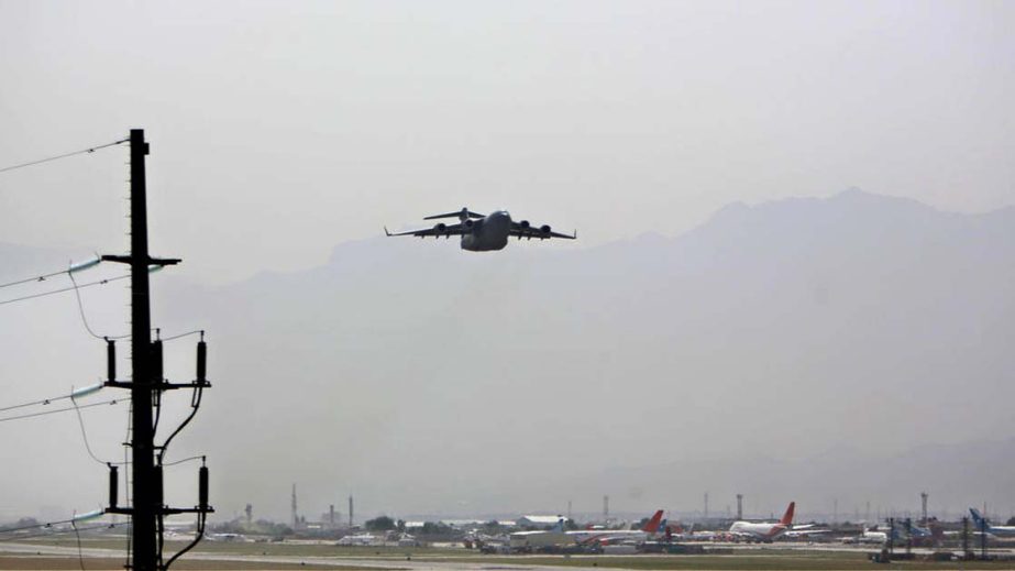 An aircraft takes off at the Hamid Karzai International Airport on Tuesday.