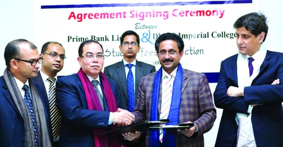 Habibur Rahman, Deputy Managing Director of Prime Bank Limited and Waliullah, Principal (In Charge) of Dhaka Imperial College, exchanging decampments of an agreement recently. The bank will collect tuition and other fees of students of the college.