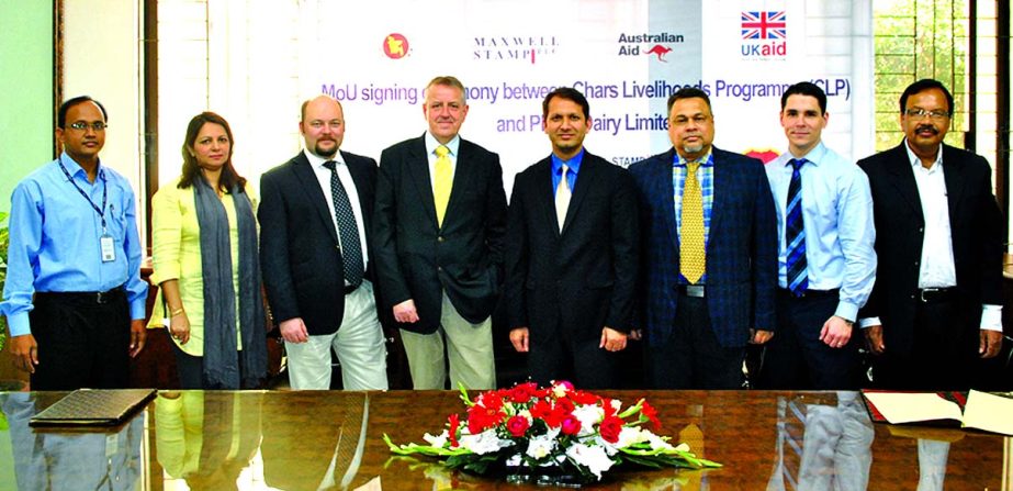 Md Anisur Rahman, Chief Operating Officer of PRAN Dairy and Matthew Richard, Team Leader of Chars Livelihoods Programme (CLP) sign MoU to enhance dairy farmers in northern Bangladesh. PRAN Dairy will collect milk from CLP's 120 milk centre from that area