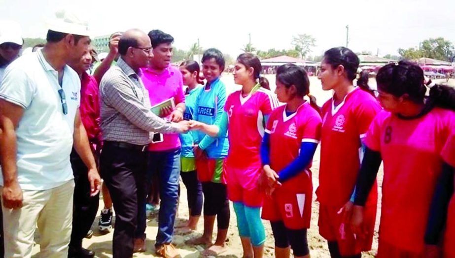 DC of Cox's Bazar Md Ali Hossain being introduced with the players of the participating teams of the Marcel Television First Open Women's Beach Kabaddi Competition at the Laboni Point of Cox's Bazar Sea Beach on Friday.
