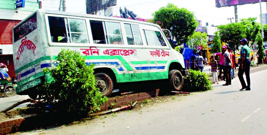 A passenger bus on Friday rammed over the island in city's Mirpur area due to reckless driving.