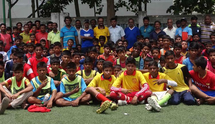 The participants of the Under-12 Boys' Footballers Open Trial Session with the coaches and officials of Bangladesh Football Federation (BFF) pose for photograph at the BFF Artificial Turf on Saturday.