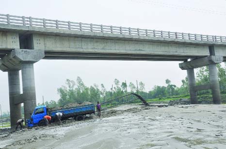 BOGRA: Illegal sand lifting from Bangali River is going on at Dhunot Upazila. This picture was taken on Sunday.