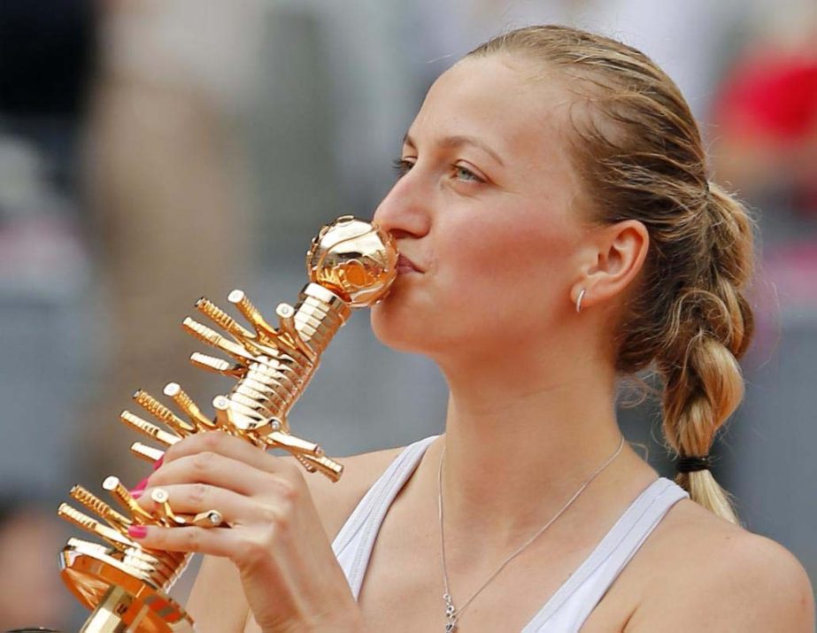 Petra Kvitova of the Czech Republic kisses the trophy after defeating Svetlana Kuznetsova of Russia in their women's singles final match at the Madrid Open Tennis tournament in Madrid, Spain, Saturday.