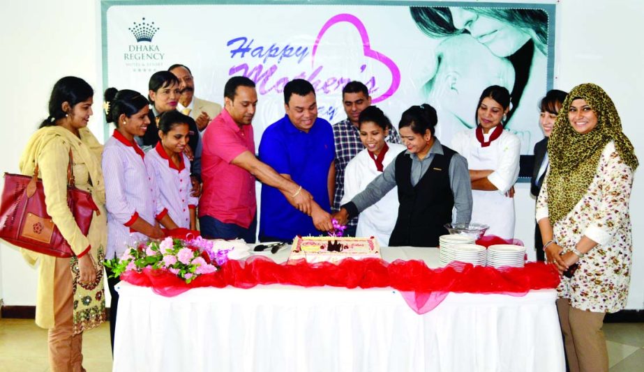 Executive Director of Dhaka Regency Hotel & Resort celebrating Mother's Day by cutting cake with all its female associates who are mothers in the hotel on May 10.