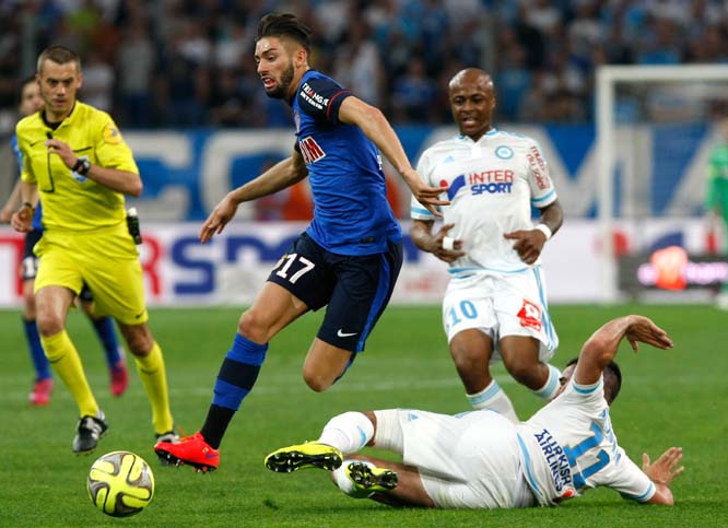 Monaco's Yannick Ferreira Carrasco (left) challenges for the ball with Marseille's Romain Alessandrini, during the League One soccer match between Marseille and Monaco at the Velodrome Stadium in Marseille, southern France on Sunday.