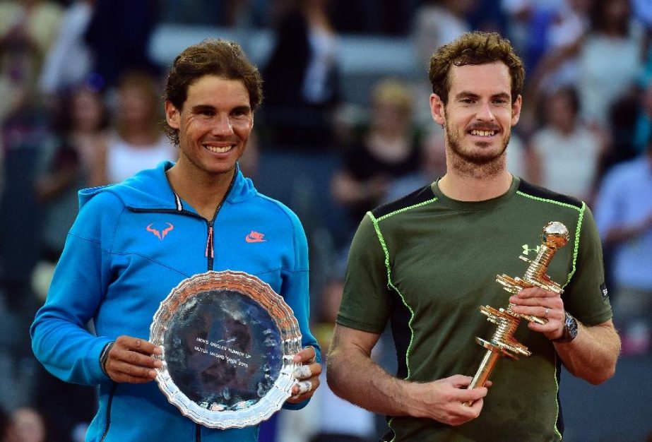 Rafael Nadal (L) and Andy Murray pose on the podium after their Madrid Open final at Caja Magica on Sunday.