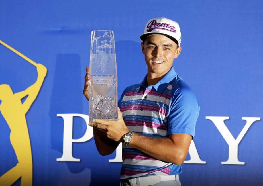 Rickie Fowler holds The Players Championship trophy in Ponte Vedra Beach, Fla on Sunday. Fowler won in a sudden death playoff against Kevin Kisner.