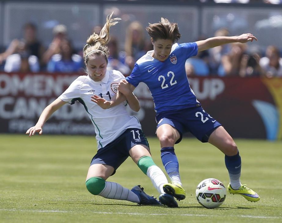 United States' Meghan Klingenberg (22) and Ireland's Julie Ann Russell (11) battle for the ball during the first half of an exhibition soccer match in San Jose, Calif on Sunday.