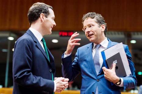 Dutch Finance Minister Jeroen Dijsselbloem, right, talks with Britain's Chancellor of the Exchequer George Osborne during a meeting of EU finance ministers at the European Council building in Brussels on Tuesday.