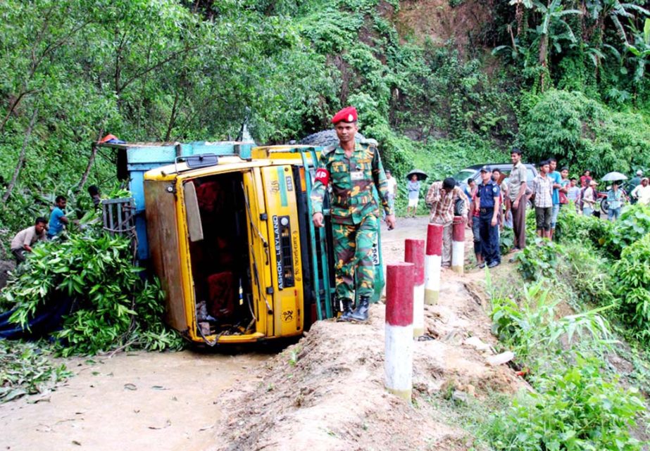 A truck has over turned at Alutila point in Khagrachhari on Monday.
