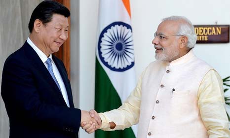 Chinese President Xi Jinping shaking hands withIndian Prime Minister Narendra Modi.