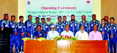 Participants of Olympic Solidarity Boxing Coaches Course with the officials of Olympic Association Solidarity Committee pose for photo at the Dutch- Bangla Bank auditorium in the city on Friday.