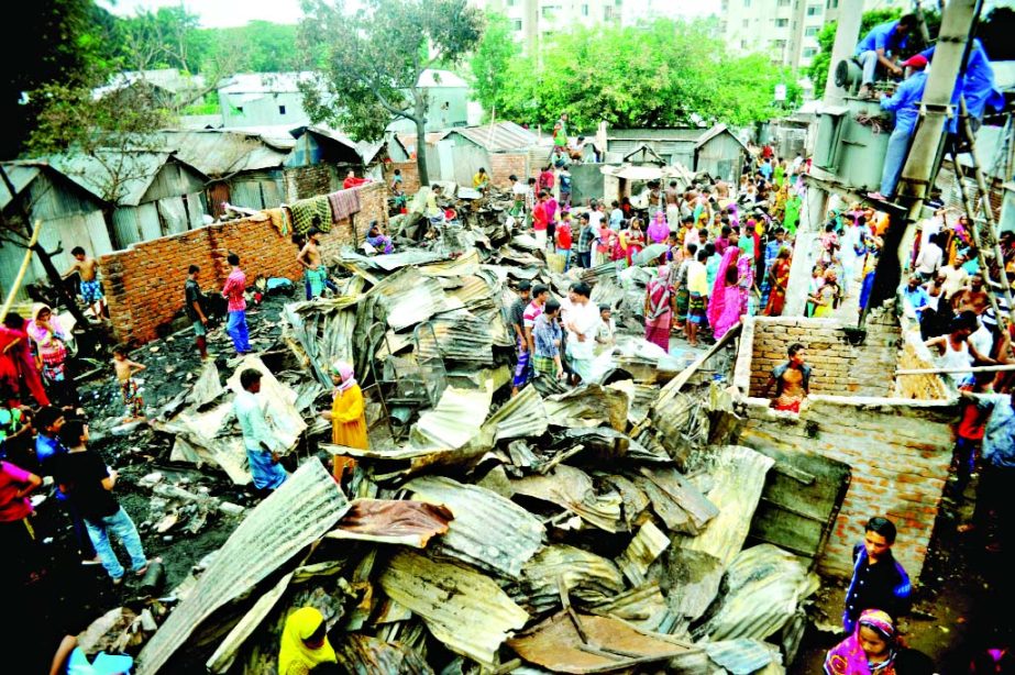 About 50 slum houses were gutted as devastating hit Saattala Bosti in city's Mohakhali on Friday.