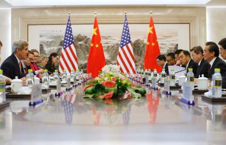 US Secretary of State John Kerry (L) holds a meeting with Chinese Foreign Minister Wang Yi (R) during their meeting at the Ministry of Foreign Affairs in Beijing on Saturday.