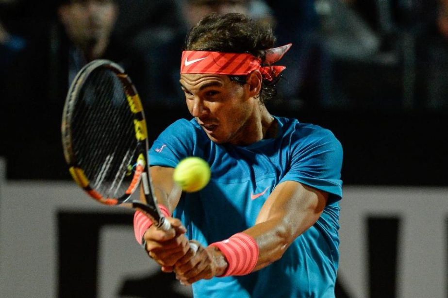 Rafael Nadal of Spain returns a ball to Stan Wawrinka of Switzerland during their ATP Tennis Open match in Rome on Friday.