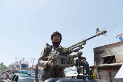 Afghan security forces patrol in Kunduz which borders Tajikistan and where over 200 people have died and 10,000 been displaced by a militant offensive