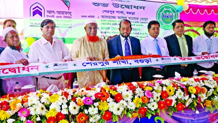 Abdul Malek Mollah, Vice Chairman of the Executive Committee of Al-Arafah Islami Bank Ltd, inaugurating its 120th branch at Dhunot Mor, Sherpur, Bogra on Sunday. Md Habibur Rahman, Managing Director of the bank presided.