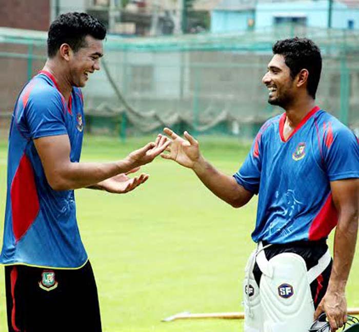 Taskin Ahmed (left) and Mahmudullah Riyad (right) chatting during the practice session at the BCB-NCA Ground in Mirpur on Tuesday.