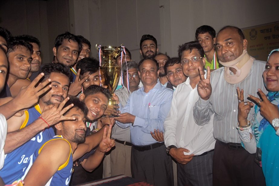 Members of Jahangirnagar University team receiving the champions trophy of the Inter-University Basketball Competition at the Gymnasium of Jahangirnagar University on Monday.