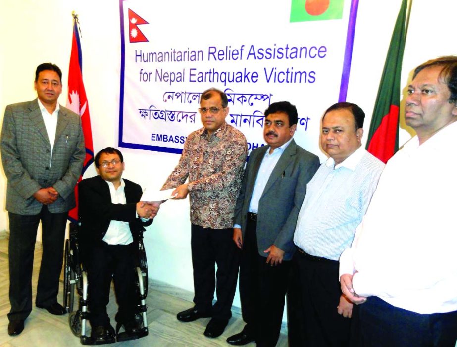 ICAB President Masih Malik Chowdhury FCA handing over a cheque of Tk1million to Deputy Chief of Nepal Embassy Sushil Kumar Lamsal for rehabilitation of Nepal's earthquake victims. ICAB Vice President Kamrul Abedin FCA, Council Members Dewan Nurul Islam