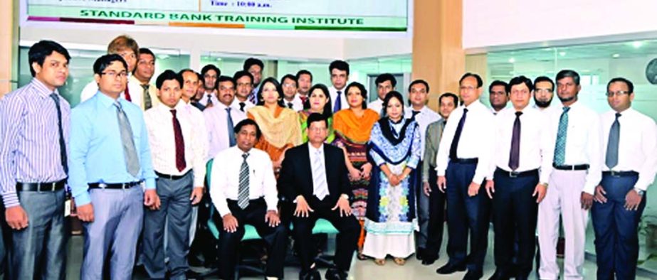 Md Nazmus Salehin, Managing Director of Standard Bank Limited poses with the participants of a two-day long workshop on "Office Management" organized by the banks training institute. Md Zakaria, Principal of the Institute was present.