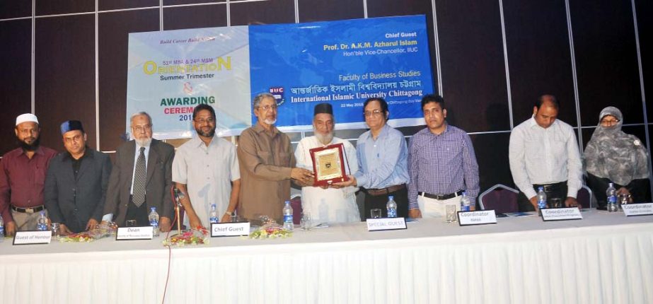 Vice Chancellor of Islamic International University Chittagong Dr AKM Azharul Islam handing over IIUC Executive Award-2015 to Ahmed Sheparuddin, Executive Director of PHP Group for pioneering role in the IIUC at a function on the campus yeste