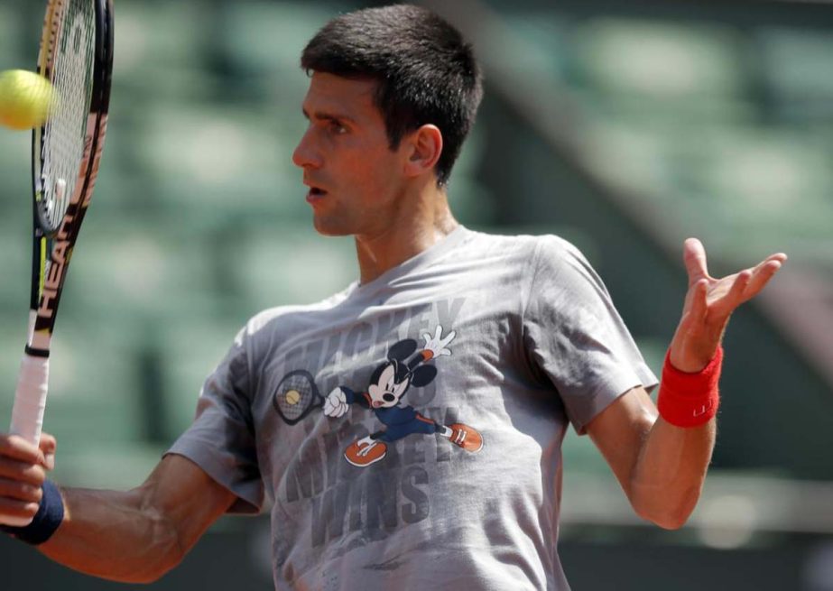 Serbia's Novak Djokovic returns the ball during a training session for the French Tennis Open at the Roland Garros stadium in Paris on Friday. The French Open starts Sunday.