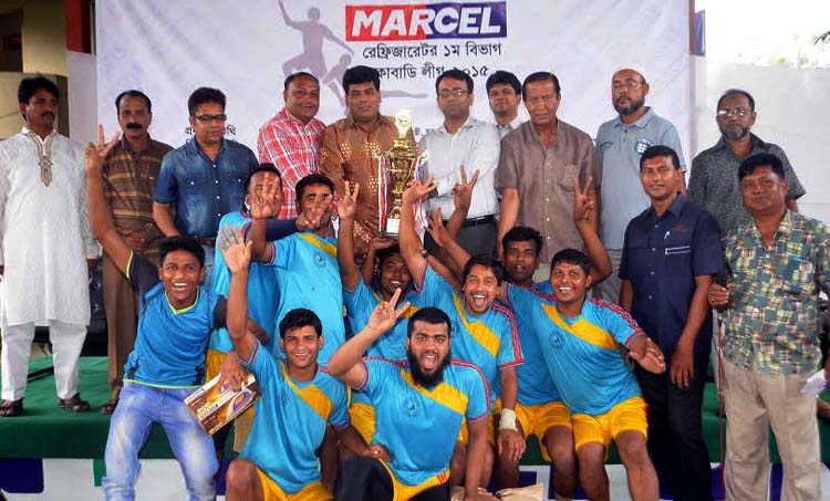 Members of Institute of Kabaddi, the champions of the Marcel Refrigerator 18th First Division Kabaddi League with the guests and the officials of Bangladesh Kabaddi Federation pose for a photo session at the Kabaddi Stadium on Sunday.