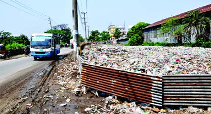 Influentials in a bid to occupy public lands, encouraging people to dump garbage beside the Dhaka-Sylhet highway. This photo was taken from city's Konapara area on Saturday.