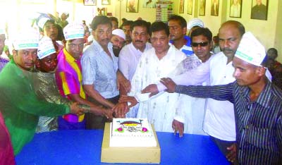 DINAJPUR: Leaders of Bangladesh Awami Matsyajibee League, Dinajpur District Unit cutting cake to mark the 12th founding anniversary of Nazma Rahim Foundation on Friday.