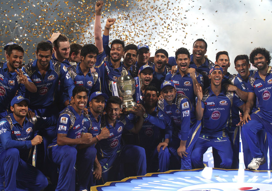 Players of Mumbai Indians celebrate with the IPL 2015 trophy on Sunday night.