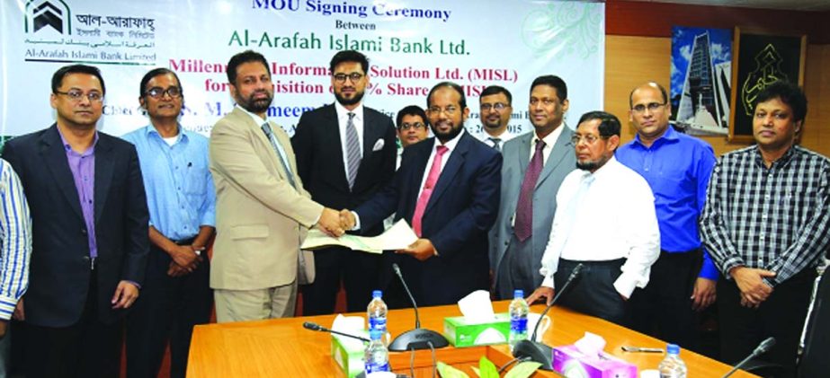 Md Habibur Rahman, Managing Director of Al-Arafah Islami Bank Ltd and Mahmud Hossain, Managing Director of Millennium Information Solution Ltd sign a Memorandum of Understanding to buy shares of the MISL at the bank's board room on Tuesday. Vice Chairman