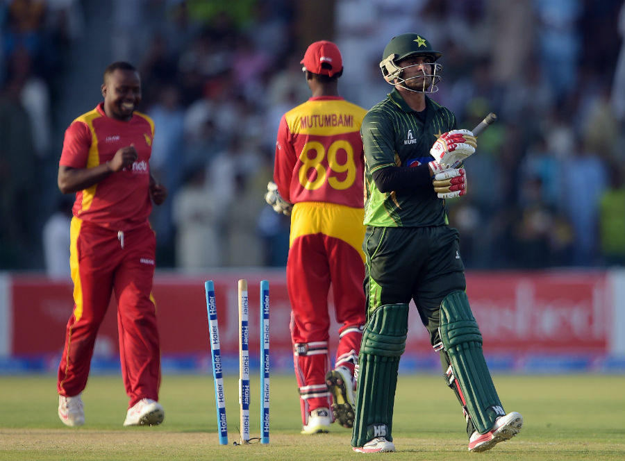 Mohammad Hafeez walks back after being dismissed by Prosper Utseya during the 1st ODI between Pakistan and Zimbabwe at Lahore on Tuesday.