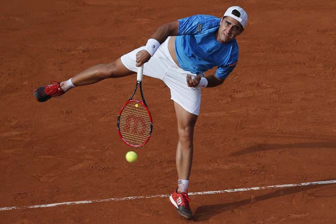 Argentina's Facundo Arguello serves in the first round match of the French Open tennis tournament against Britain's Andy Murray at the Roland Garros stadium in Paris, France on Monday.