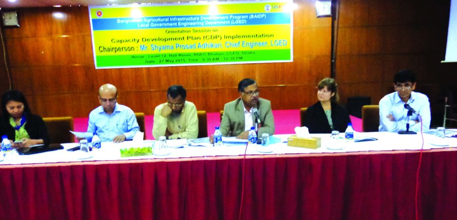 Shyama Prosad Adhikari, Chief Engineer of Local Government Engineering Department presiding over orientation session on 'Capacity Development Plan' implementing by BAIDP at LGED headquarter in the city on Wednesday. ACE of LGED Md Mohsin, Project Direct