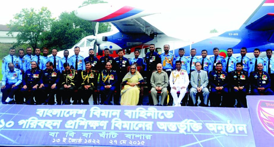Prime Minister Sheikh Hasina along with high Army and Air Force officials pose for photograph at the induction ceremony of L-410 Transport Trainer Aircraft to the Air Force fleet at BAF Base Bashar in the city on Wednesday. BSS photo