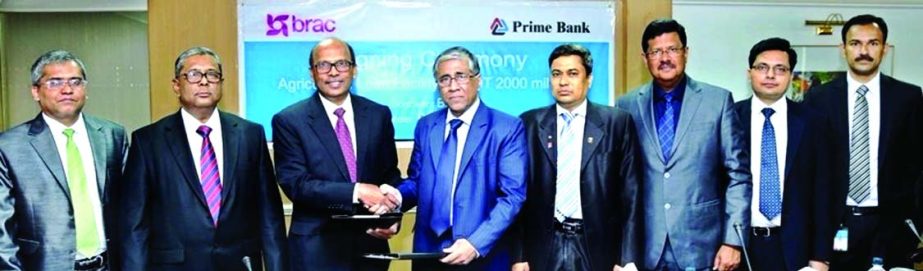 Ahmed Kamal Khan Chowdhury, Managing Director of Prime Bank Limited and SN Kairy, Chief Financial Officer of BRAC and BRAC International, exchanging signed documents recently to provide agricultural loan of BDT 2000 million to farmers for crop cultivation