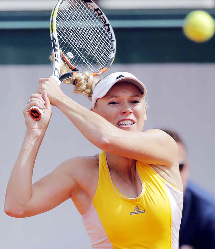 Denmark's Caroline Wozniacki returns in the second round match of the French Open tennis tournament against Germany's Julia Georges at the Roland Garros stadium in Paris, France on Thursday.