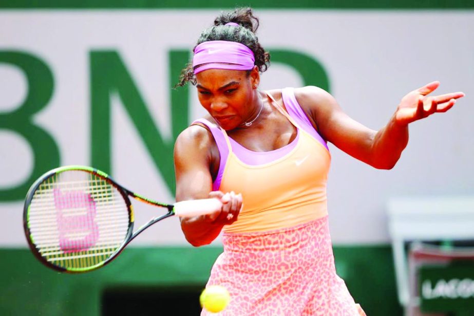 Serena Williams of the United States plays a forehand in her Women's Singles match against Anna-Lena Friedsam of Germany on day five of the 2015 French Open at Roland Garros on Thursday in Paris, France.