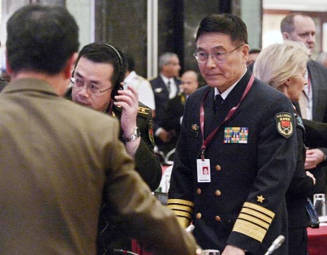 Sun Jianguo (R) from the Chinese PLA Navy, attends US Secretary of Defence Ashton Carter's speech during the 14th Asia Security Summit in Singapore on Saturday.