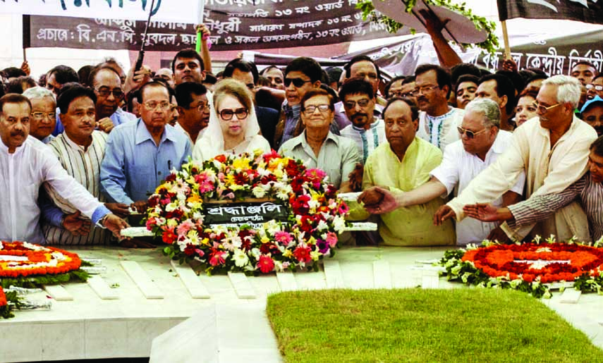 BNP Chairperson Begum Khaleda Zia along with party colleagues placing floral wreaths at the mazar of Shaheed President Ziaur Rahman in the city on Saturday on the occasion of the latter's 34th martyrdom anniversary.
