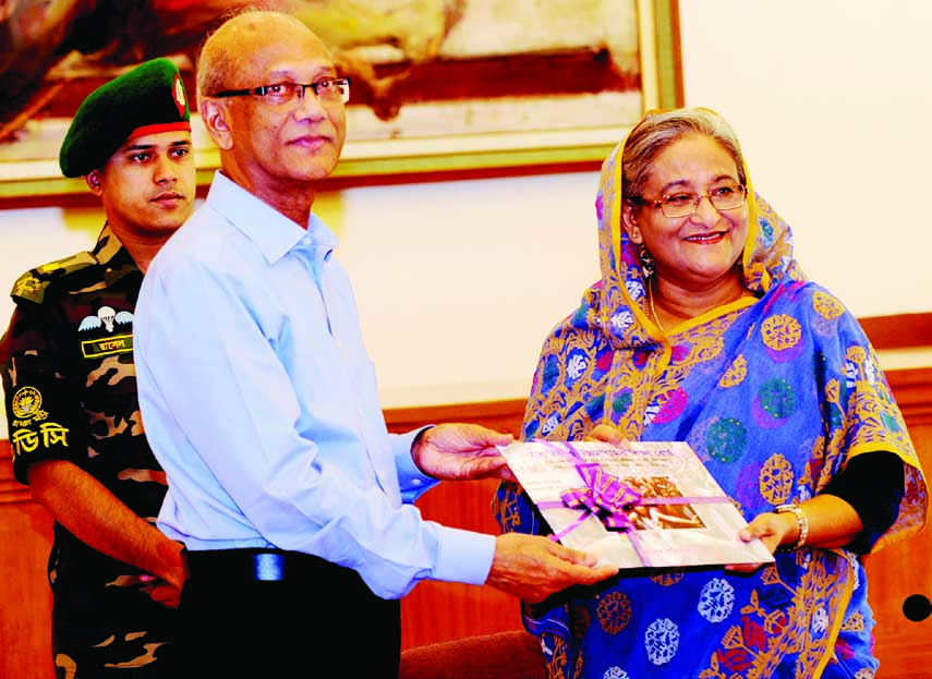 Education Minister Nurul Islam Nahid handing over result sheets of the SSC and equivalent examinations of all education boards to Prime Minister Sheikh Hasina at Ganobhaban in the city on Saturday. BSS photos