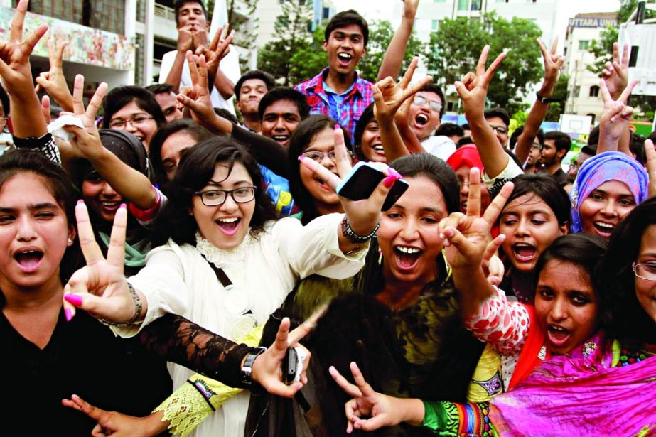 Students of Rajuk Uttara Model School and College rejoicing after securing the second position in SSC examinations of Dhaka Education Board on Saturday.