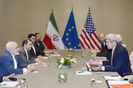 US Secretary of State John Kerry, right, speaks with Iranian Foreign Minister Mohammad Javad Zarif, left, prior to a bilateral meeting for a new round of Nuclear Talks with Iran at the Intercontinental Hotel, in Geneva, Switzerland on Saturday.