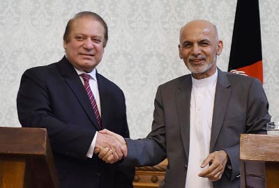 Pakistani Prime Minster Nawaz Sharif (left) shakes hands with Afghan President Ashraf Ghani during a press conference at the Presidential palace in Kabul