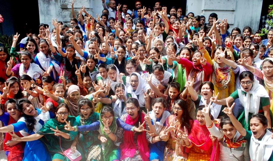 Students of Dr Khantagir Govt Girls' School showing v-sign after publishing SSC results on Saturday.