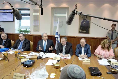 Israeli Prime Minister Benjamin Netanyahu (C-L) talks during the weekly cabinet meeting in Jerusalem on Sunday.