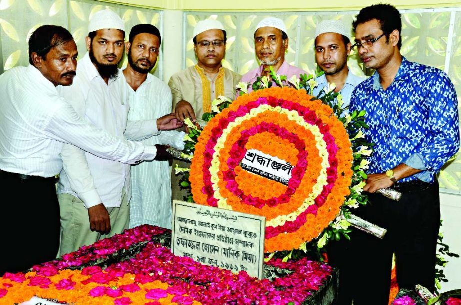 Officials and employees of The New Nation placing wreath at the grave of legendary journalist Tofazzal Hossain Manik Mia in the city's Azimpur Graveyard marking the latter's 46th death anniversary on Monday.